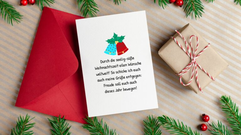 roter Umschlag und eine illustrierte Karte mit einem schönen Weihnachtsspruch