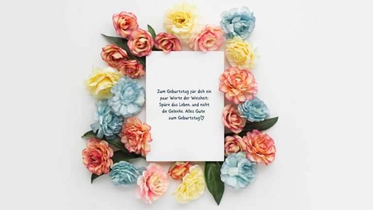 lustiger und liebevoller Wunsch zum 41. Geburtstag auf einer Karte geschrieben und von Blumen umgeben